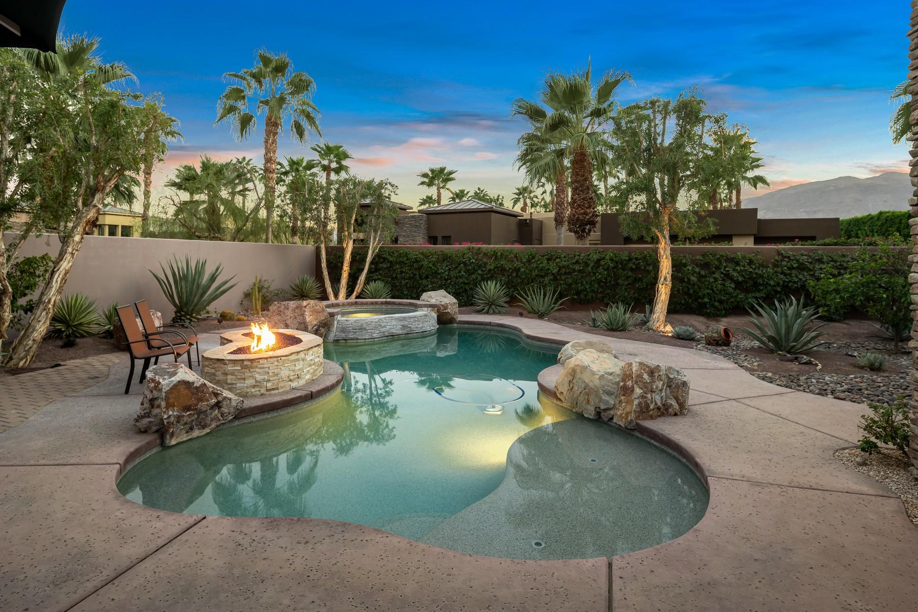 12 Dominion Court Rancho Mirage, CA 92270 - Photo 2 of 44 a view of a swimming pool with a patio