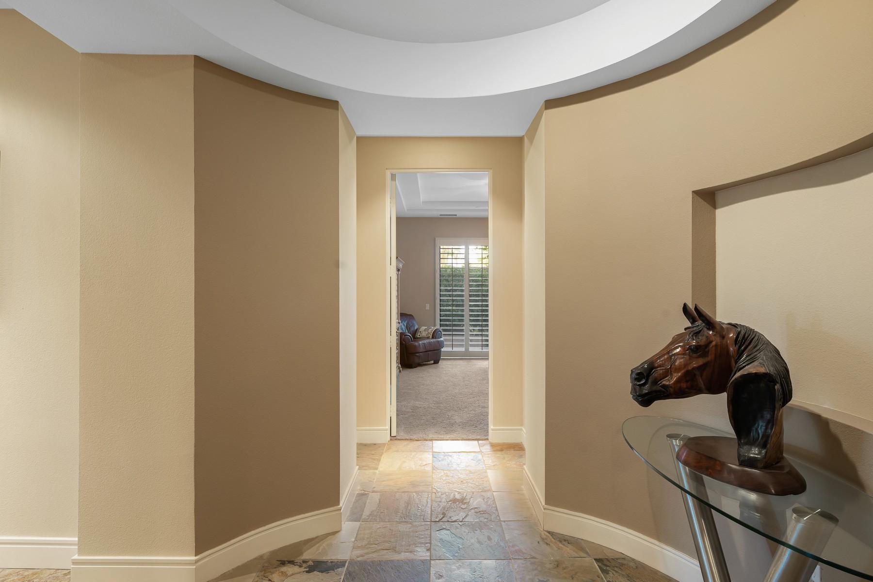 12 Dominion Court Rancho Mirage, CA 92270 - Photo 18 of 44 a view of a hallway with workspace and a mirror