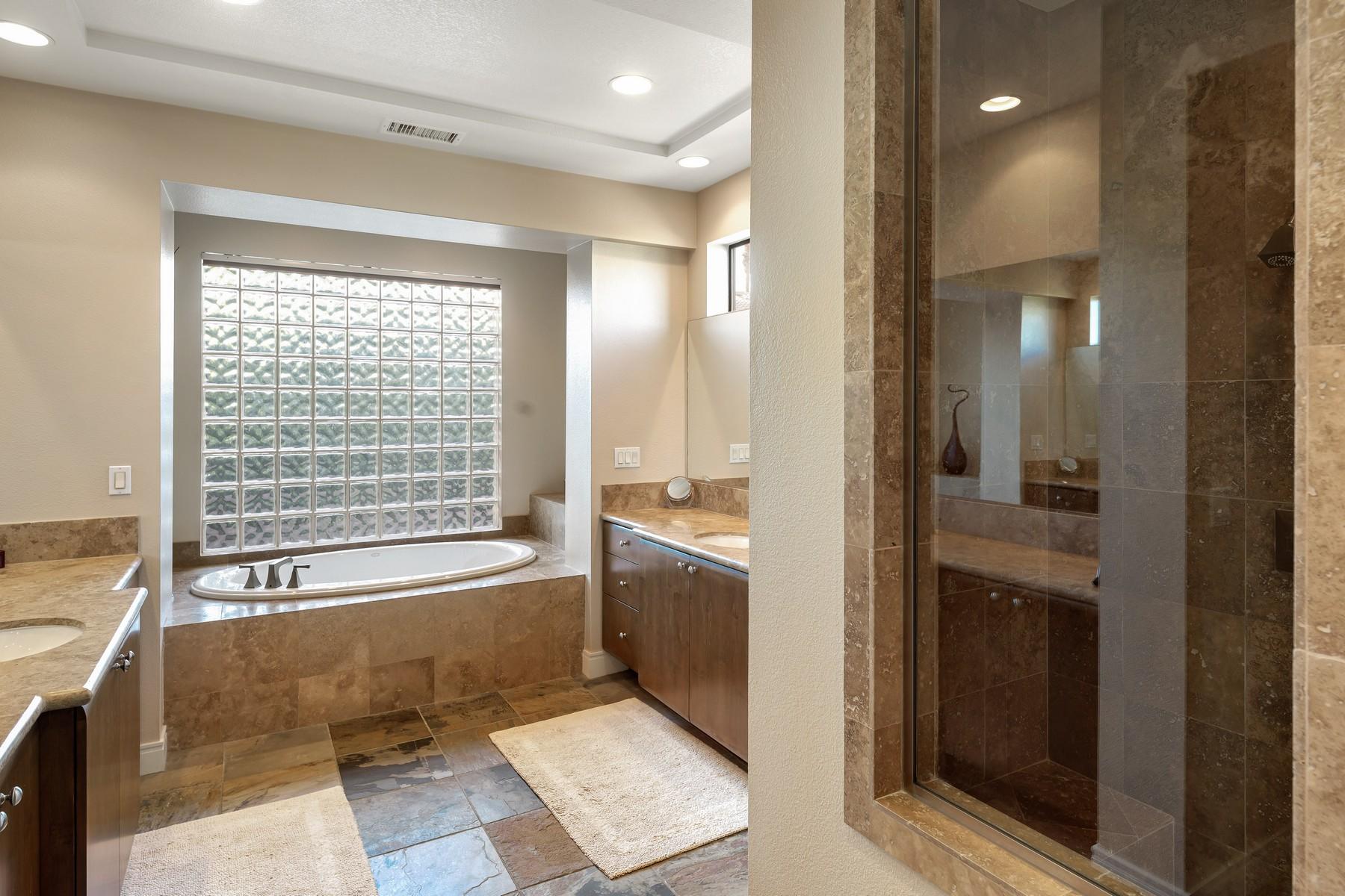 12 Dominion Court Rancho Mirage, CA 92270 - Photo 21 of 44 a bathroom with a bathtub and a shower