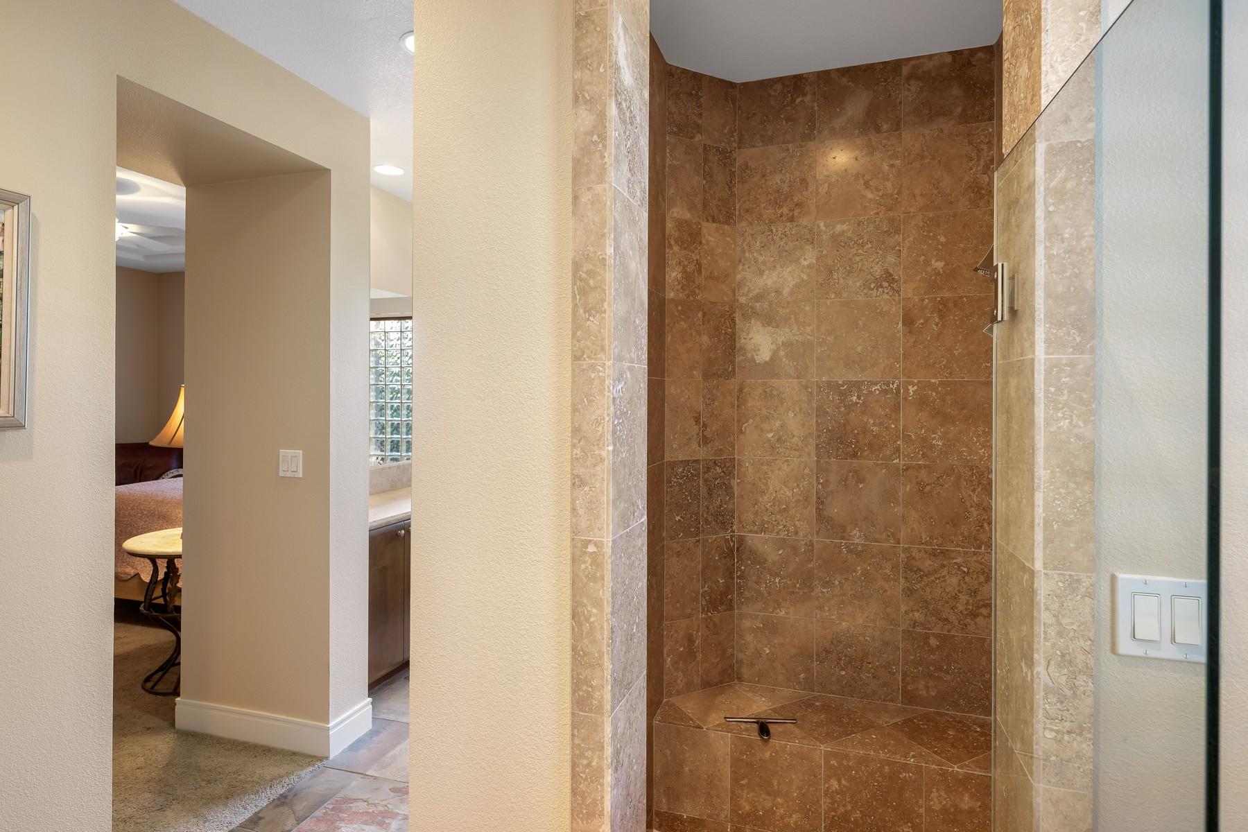 12 Dominion Court Rancho Mirage, CA 92270 - Photo 22 of 44 a bathroom with a shower