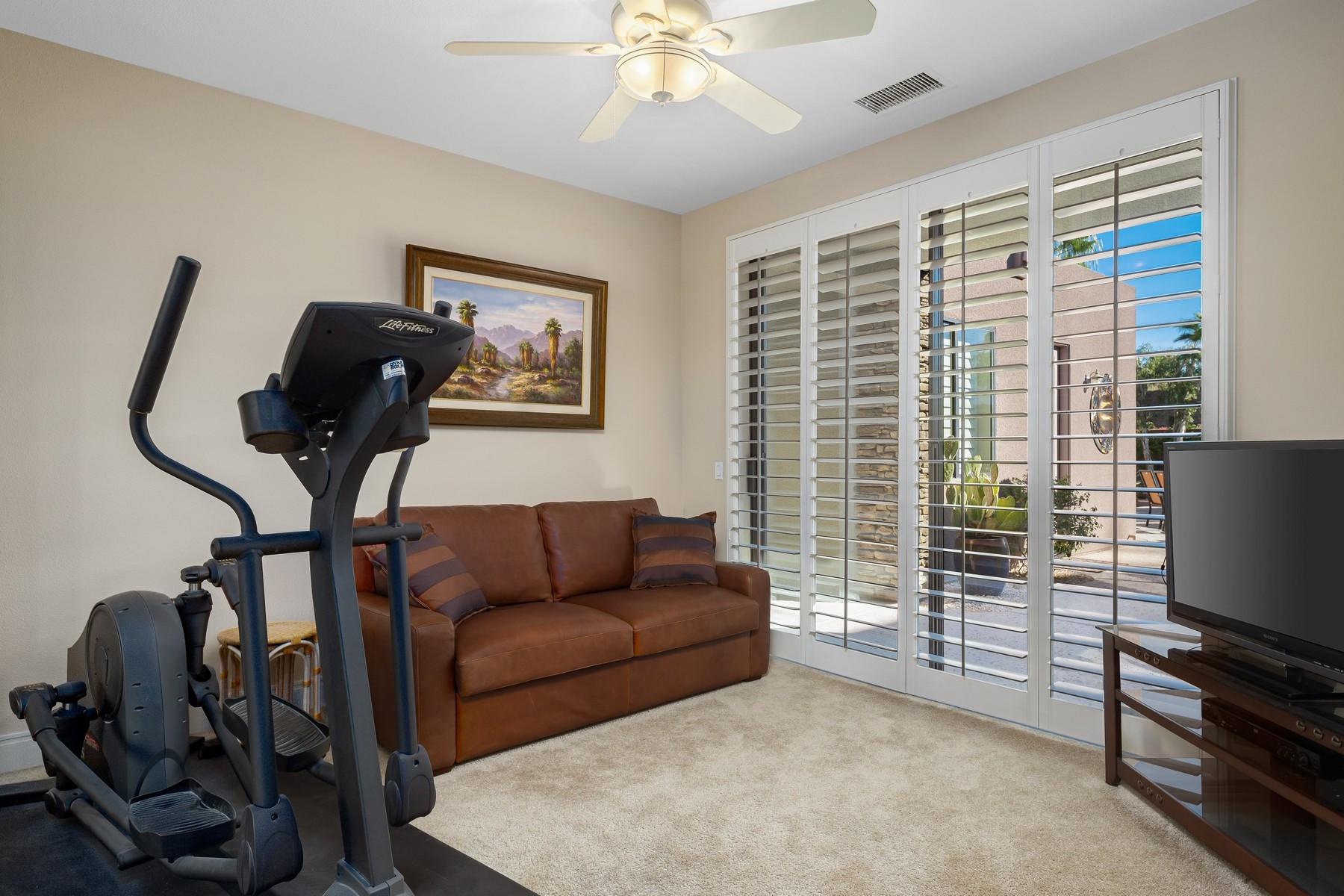12 Dominion Court Rancho Mirage, CA 92270 - Photo 25 of 44 a living room with furniture and a flat screen tv