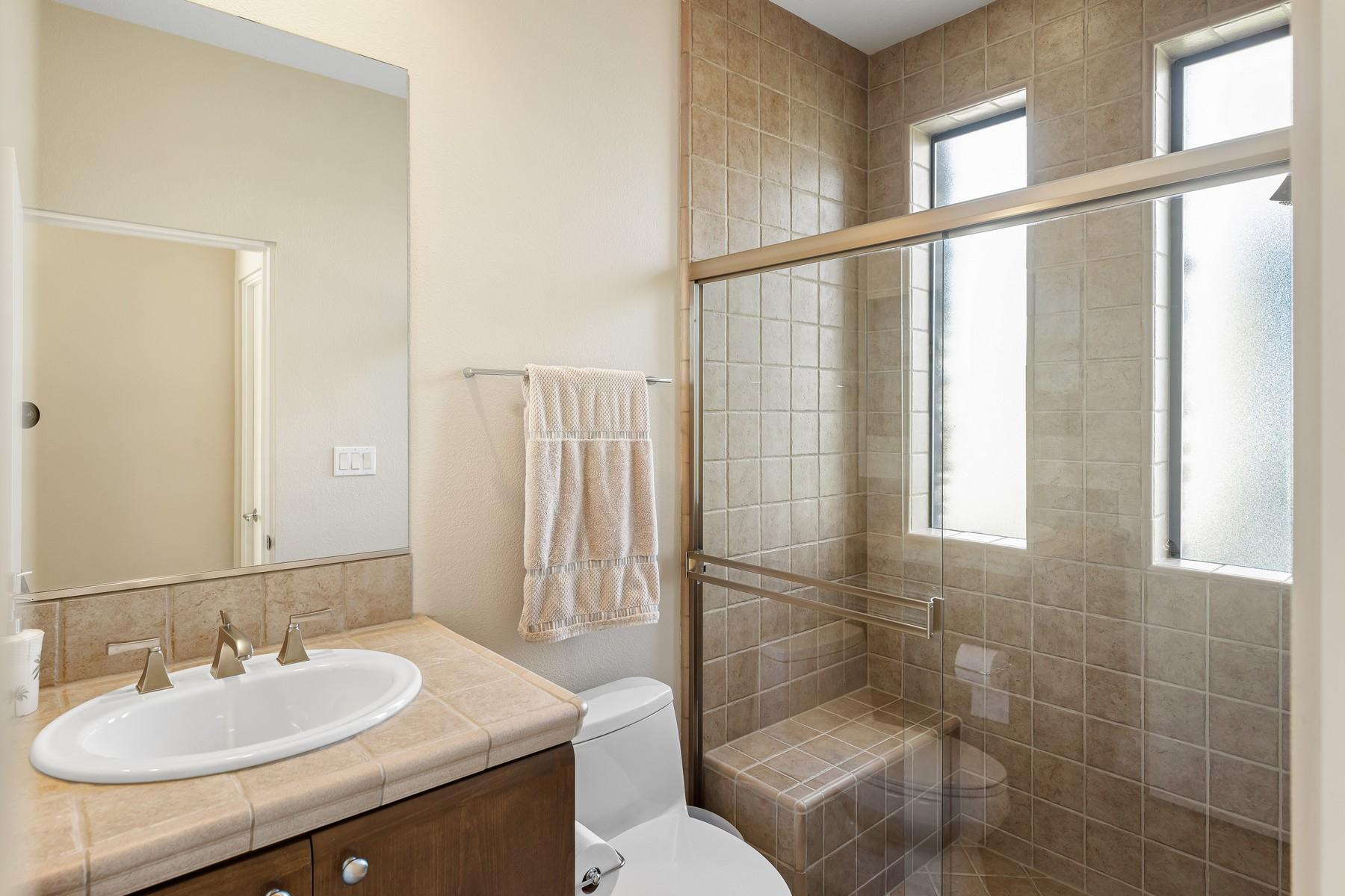 12 Dominion Court Rancho Mirage, CA 92270 - Photo 31 of 44 a bathroom with a sink toilet and shower