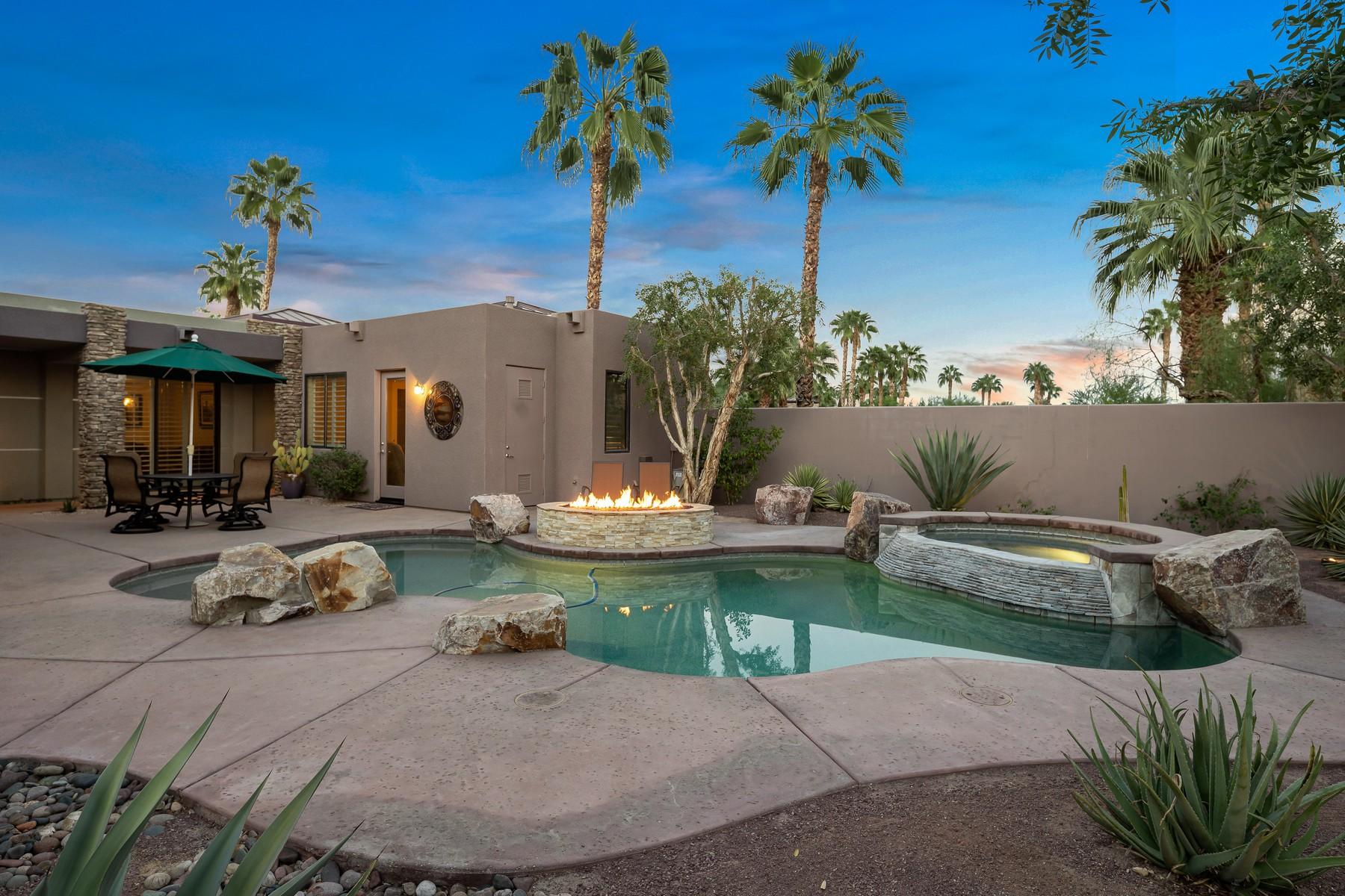 12 Dominion Court Rancho Mirage, CA 92270 - Photo 32 of 44 a view of a backyard with plants and swimming pool