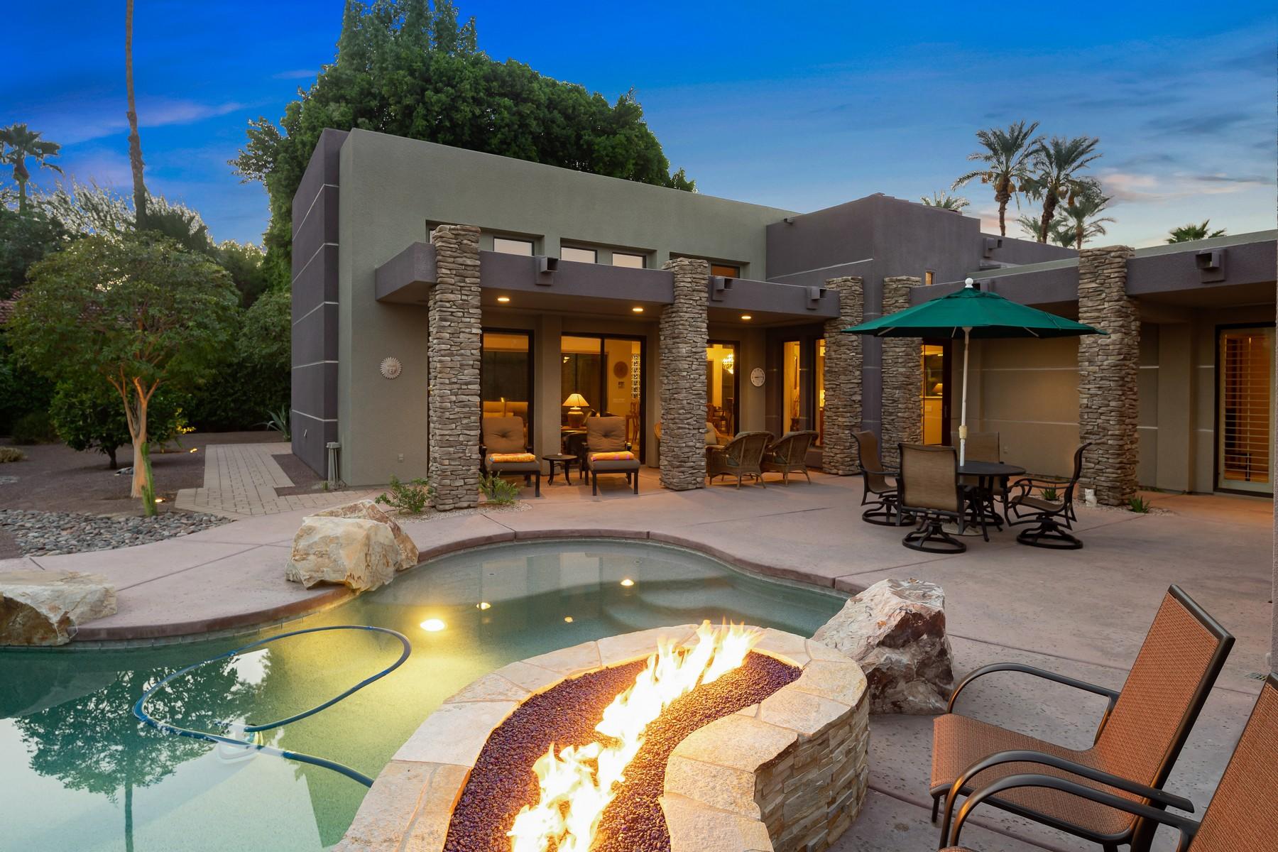 12 Dominion Court Rancho Mirage, CA 92270 - Photo 34 of 44 a view of a house with swimming pool and sitting area