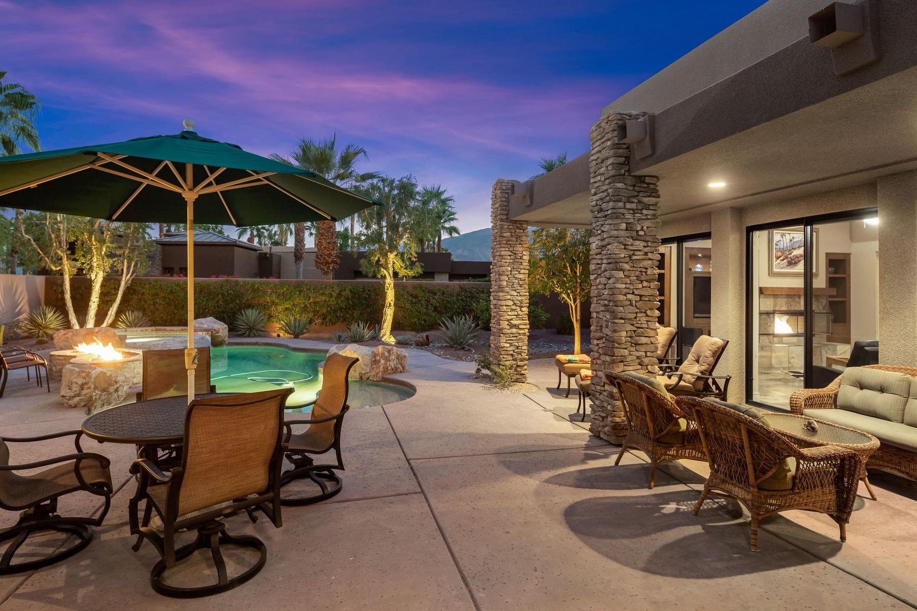 12 Dominion Court Rancho Mirage, CA 92270 - Photo 37 of 44 a view of a patio with table and chairs under an umbrella