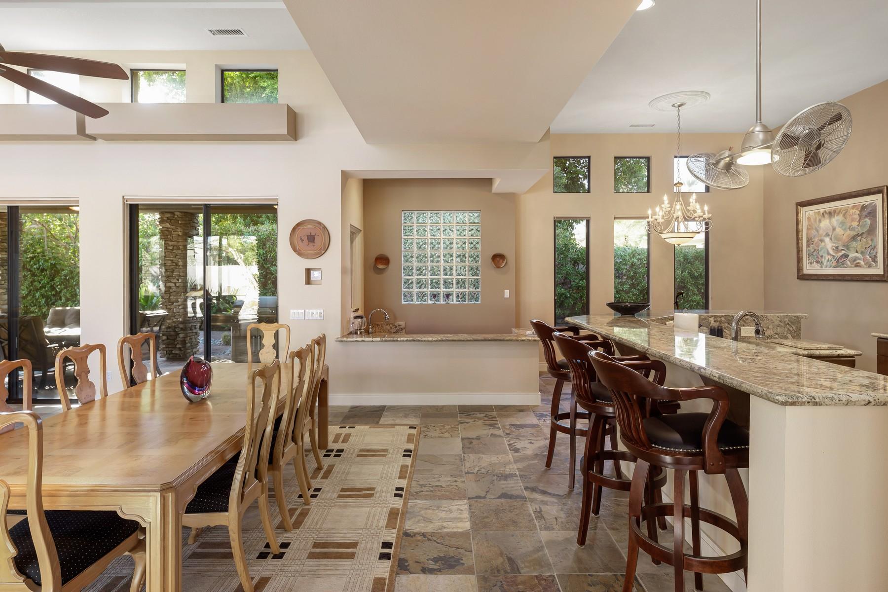 12 Dominion Court Rancho Mirage, CA 92270 - Photo 8 of 44 a view of a dining room with furniture and a chandelier