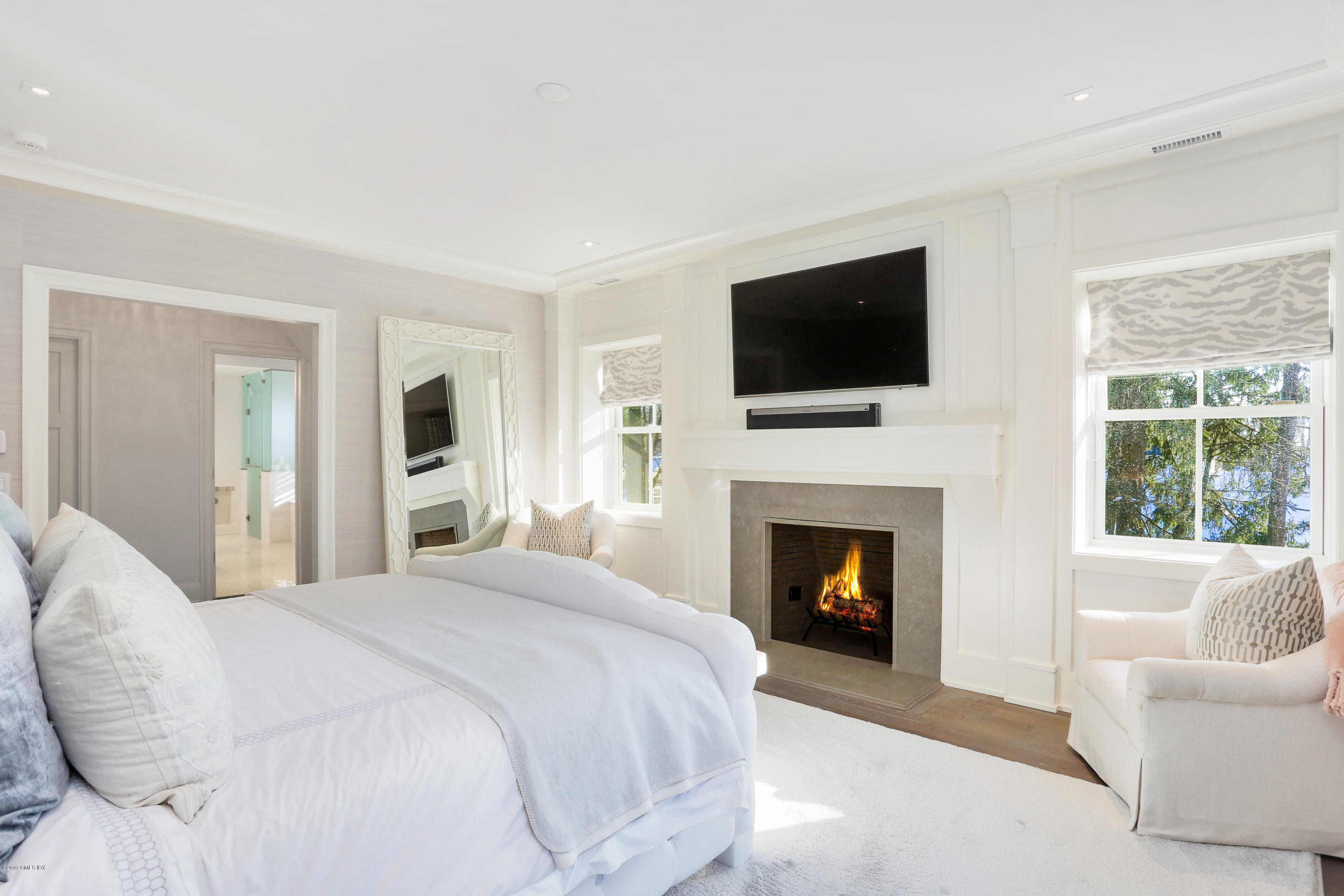 12 Longview Avenue Riverside, CT 06878 - Photo 13 of 28 a bedroom with a bed and a fireplace
