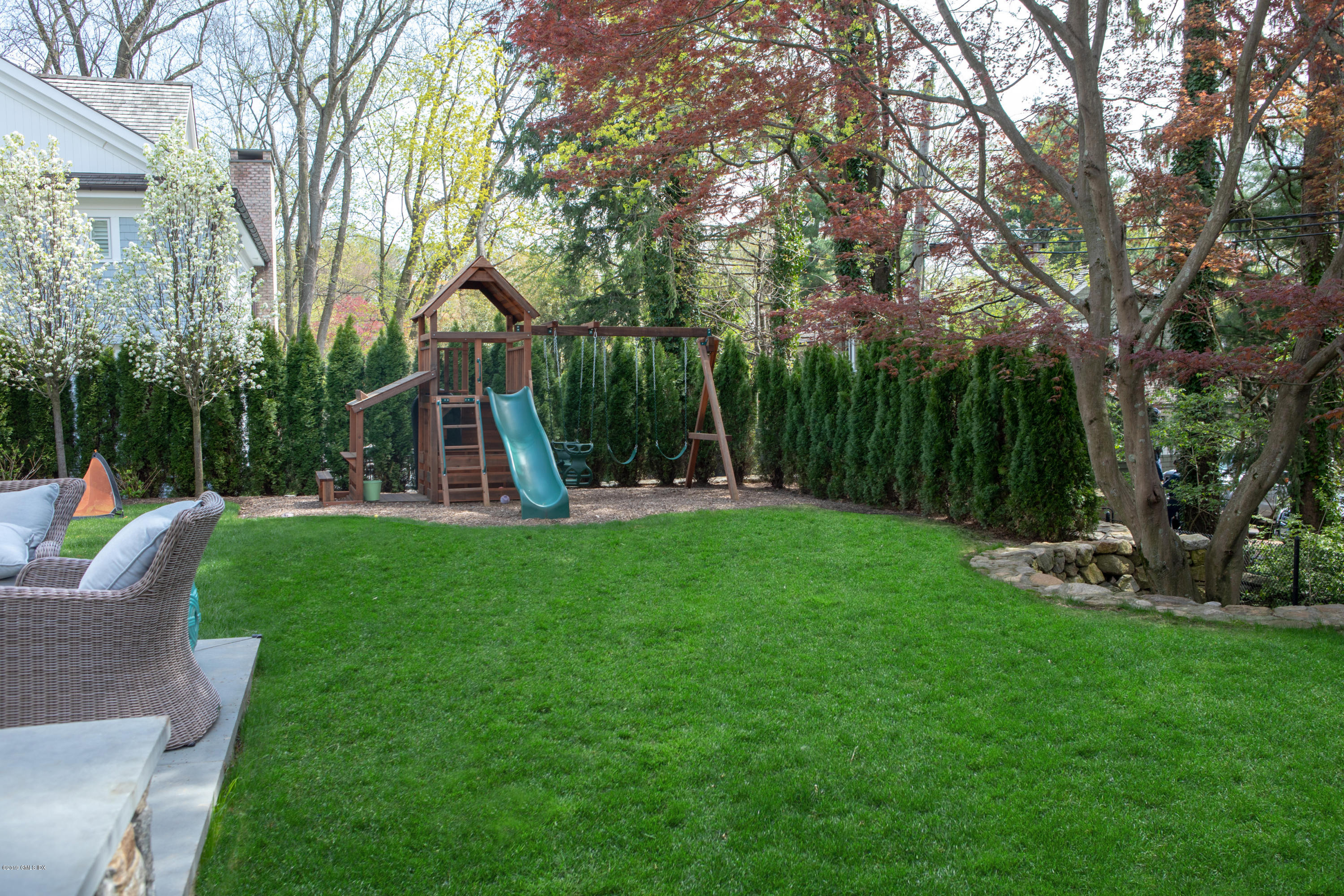 12 Longview Avenue Riverside, CT 06878 - Photo 23 of 28 a view of a garden with a slide and a tree