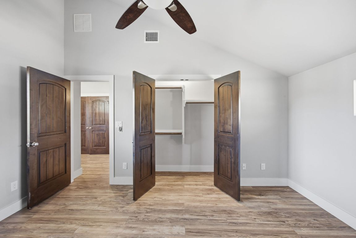 1125 Walton Lane, Unit D Austin, TX 78721 - Photo 24 of 34 a view of a hallway with wooden floor and closet