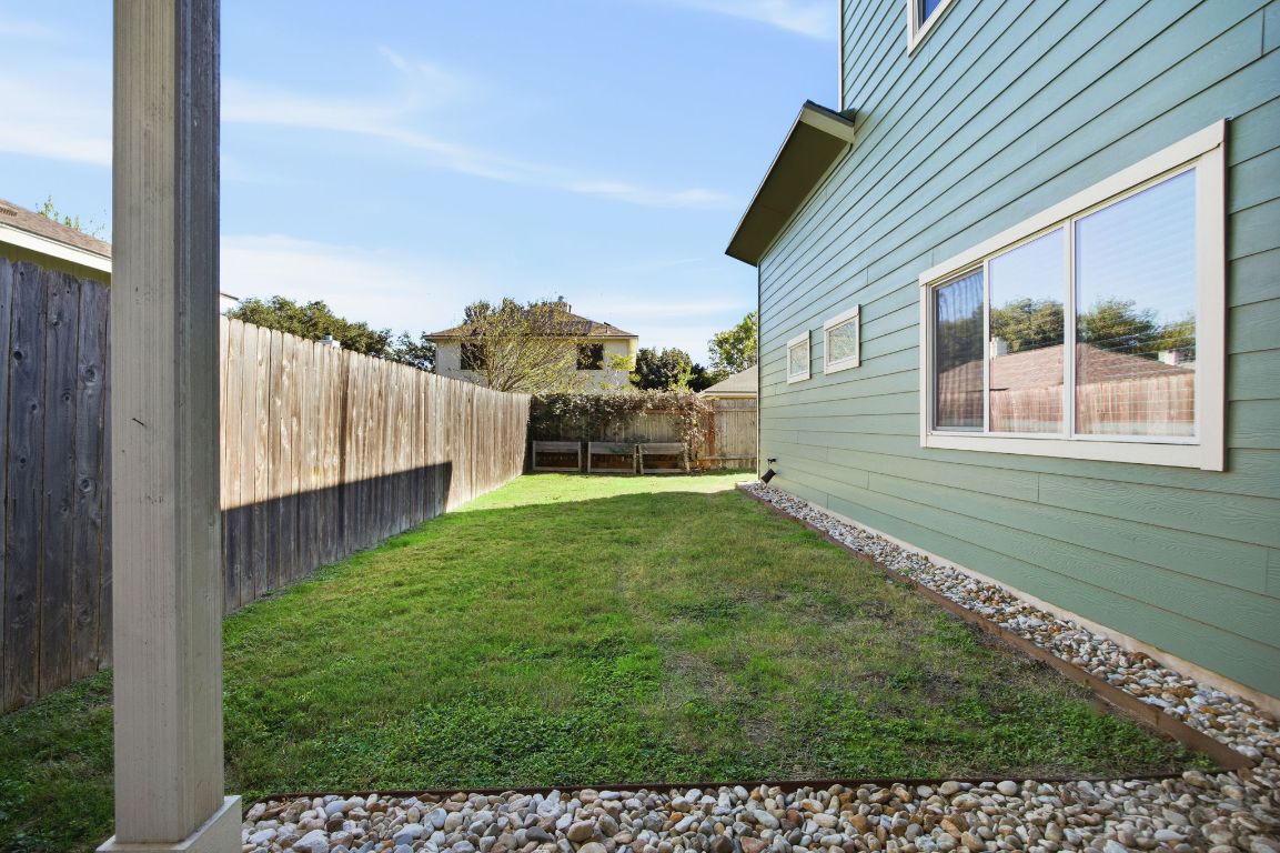 1125 Walton Lane, Unit D Austin, TX 78721 - Photo 32 of 34 a view of a backyard with potted plants
