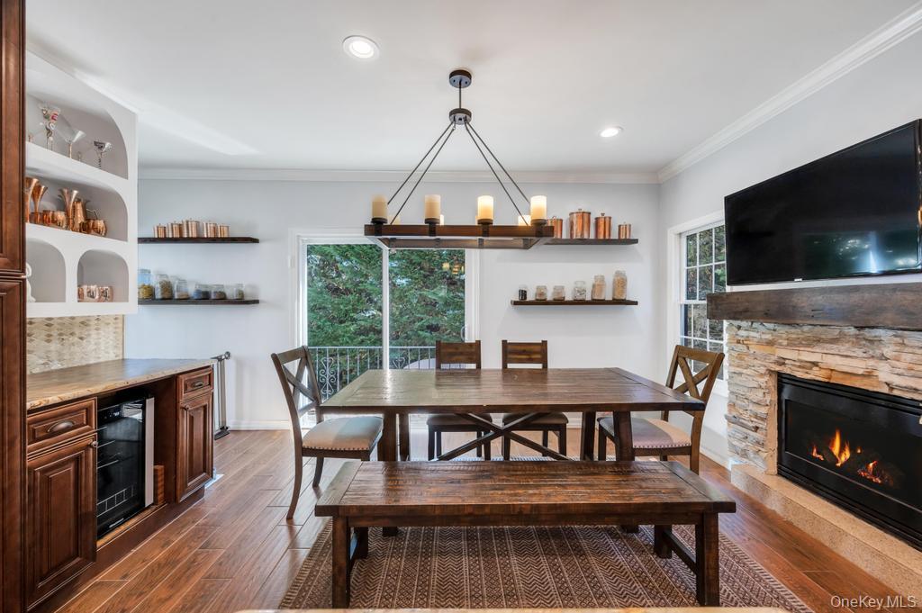 357 Wynsum Avenue Merrick, NY 11566 - Photo 22 of 40 a view of a dining room with furniture window and wooden floor