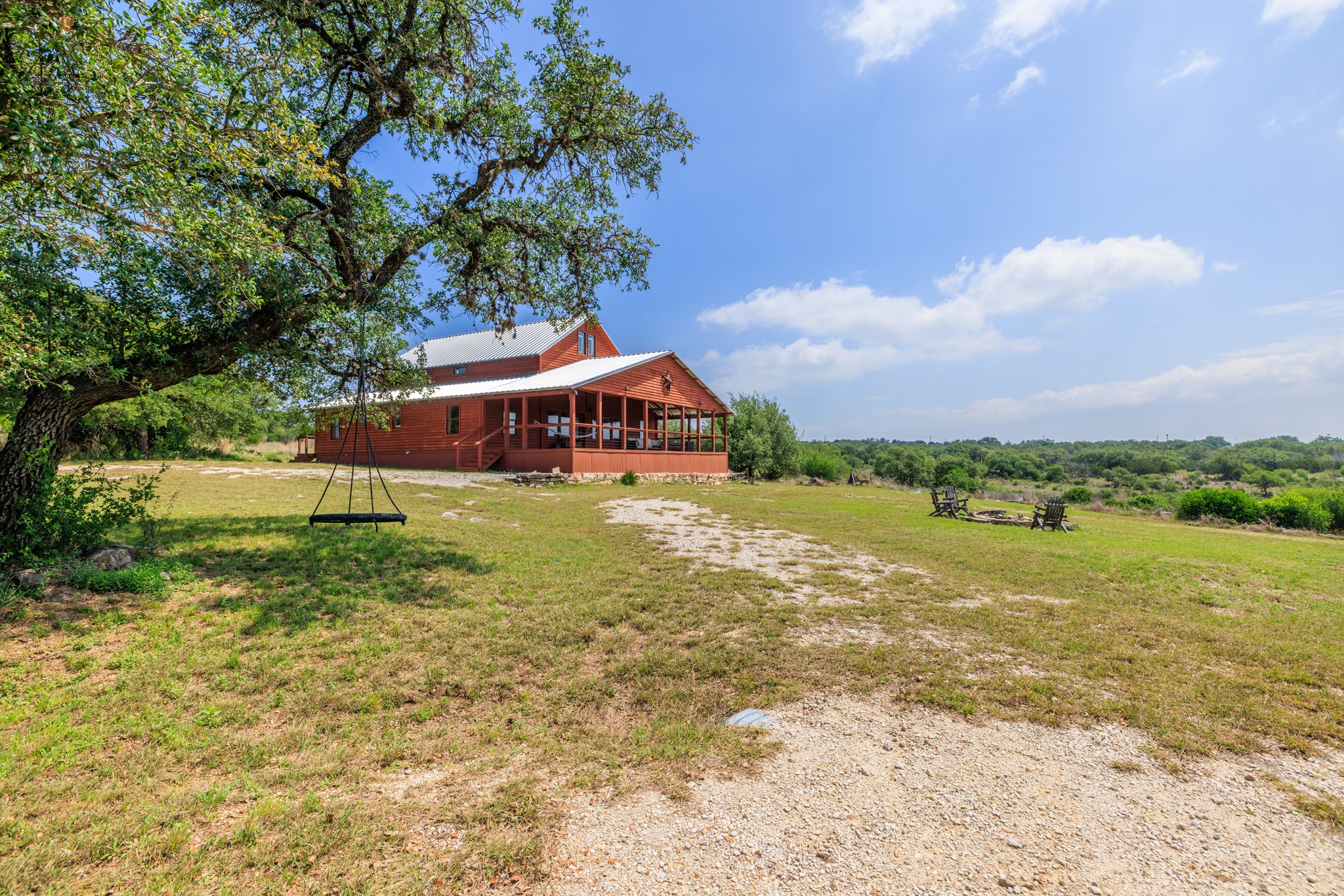 611 Weddle Road Johnson City, TX 78636 - Photo 27 of 30 a view of a house with a yard and sitting area