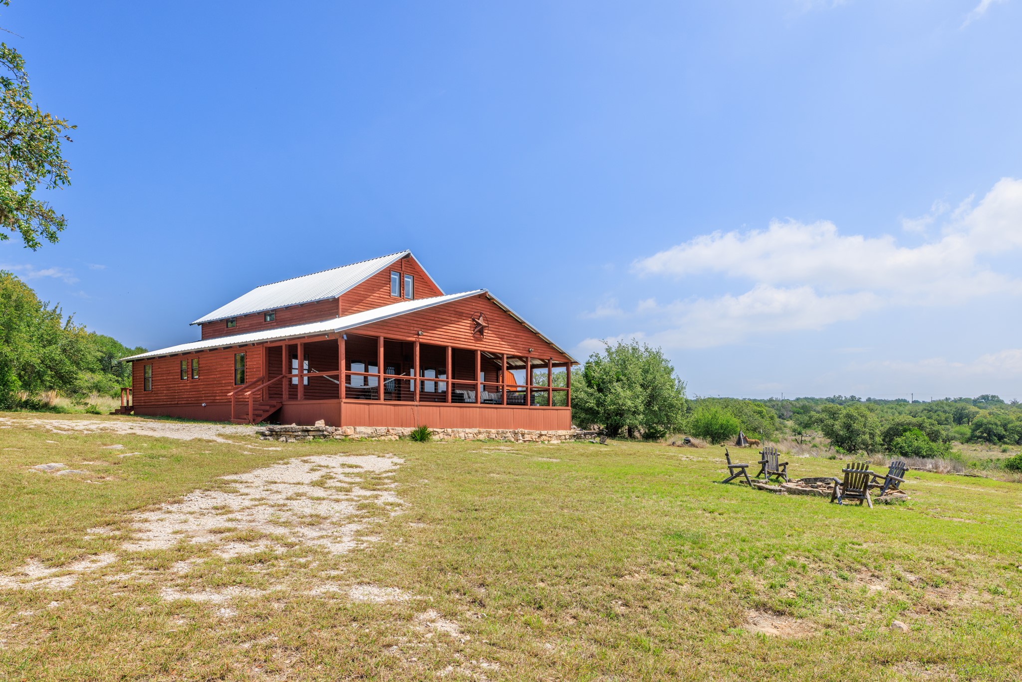 611 Weddle Road Johnson City, TX 78636 - Photo 4 of 30 a view of a house with a big yard