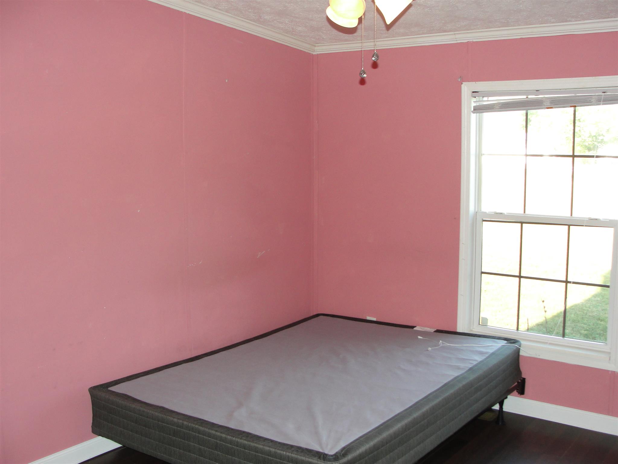 10026 Judy Road Lyles, TN 37098 - Photo 16 of 20 a bedroom with a bed and a window