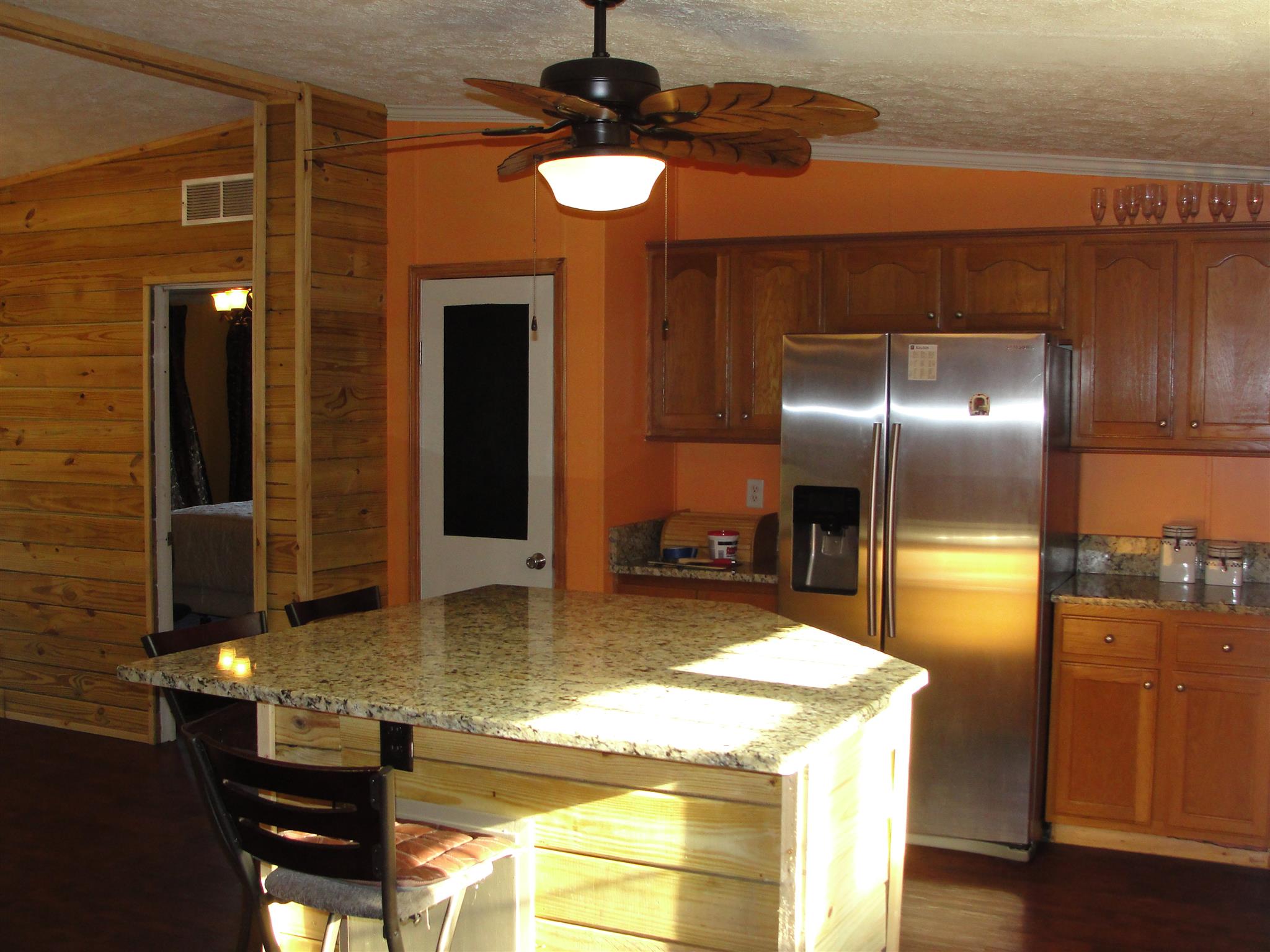 10026 Judy Road Lyles, TN 37098 - Photo 5 of 20 a kitchen with kitchen island sink and refrigerator