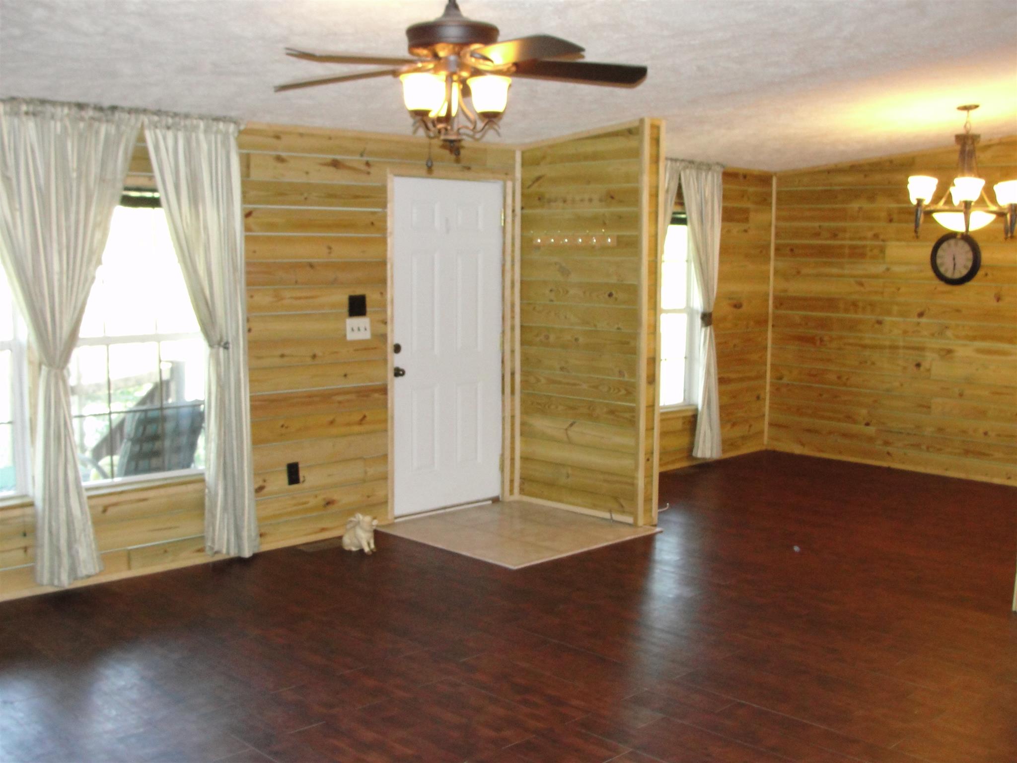 10026 Judy Road Lyles, TN 37098 - Photo 8 of 20 an empty room with wooden floor and windows
