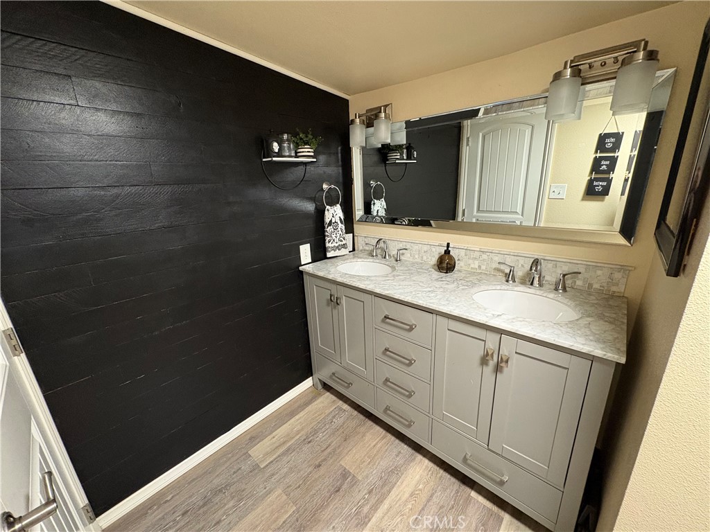 36750 Hilltop Road Yucaipa, CA 92399 - Photo 20 of 27 a bathroom with a sink and a mirror