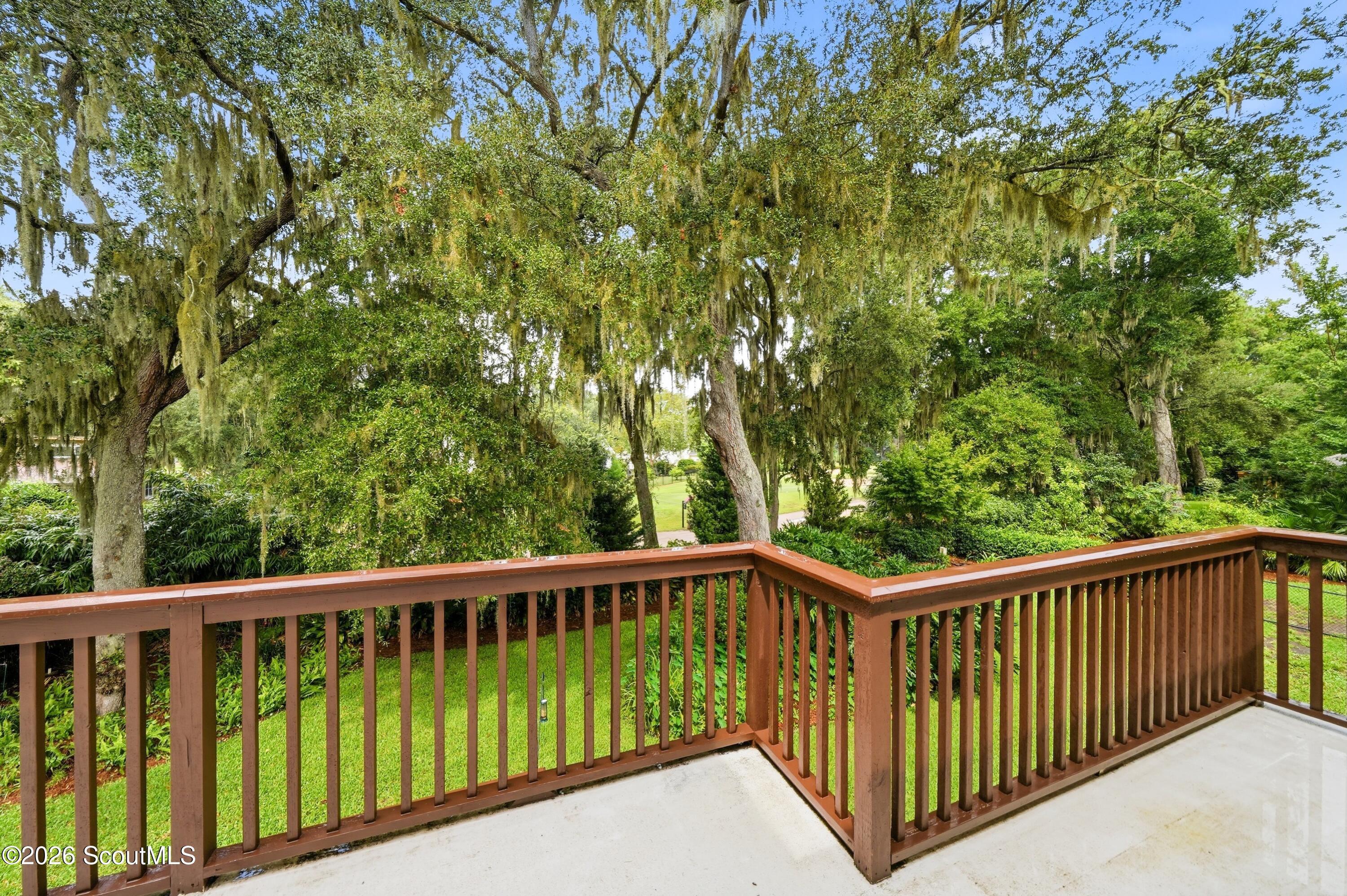 109 Tall Pine Road St. Simons Island, GA 31522 - Photo 28 of 50 French doors lead from the primary suite to the upstairs deck overlooking the backyard.