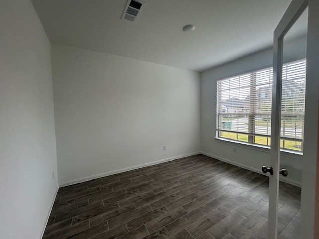 26711 Grandiflora Drive Magnolia, TX 77355 - Photo 5 of 19 an empty room with wooden floor and windows