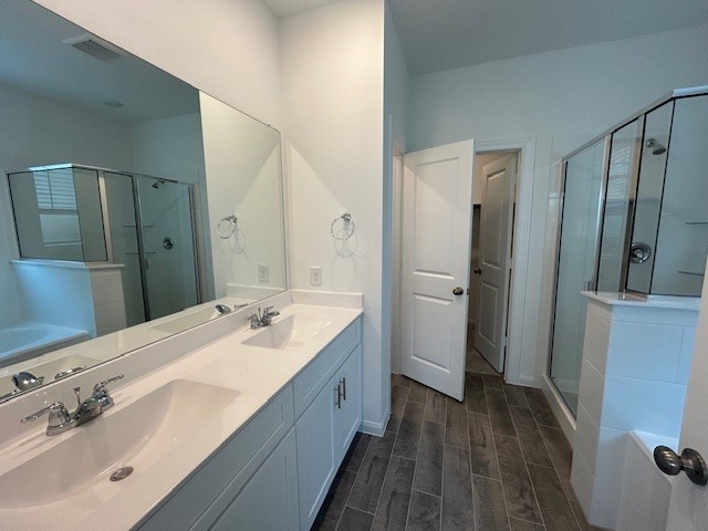26711 Grandiflora Drive Magnolia, TX 77355 - Photo 9 of 19 a spacious bathroom with a double vanity sink and mirror