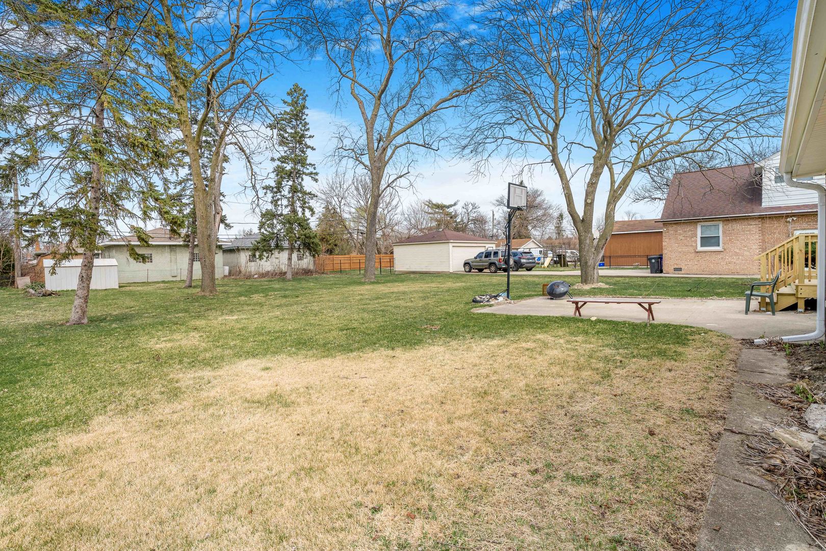 8110 46th Street Lyons, IL 60534 - Photo 20 of 26 a view of a park with swings and a fire pit