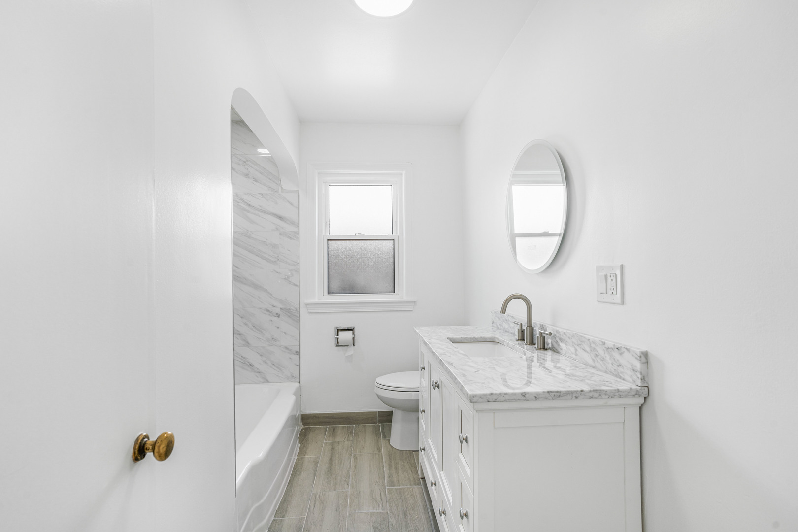 8110 46th Street Lyons, IL 60534 - Photo 10 of 26 a bathroom with a sink and a mirror