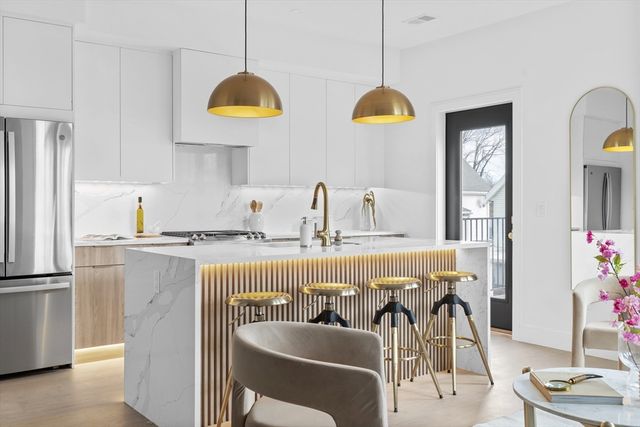 a view of kitchen with furniture and chandelier