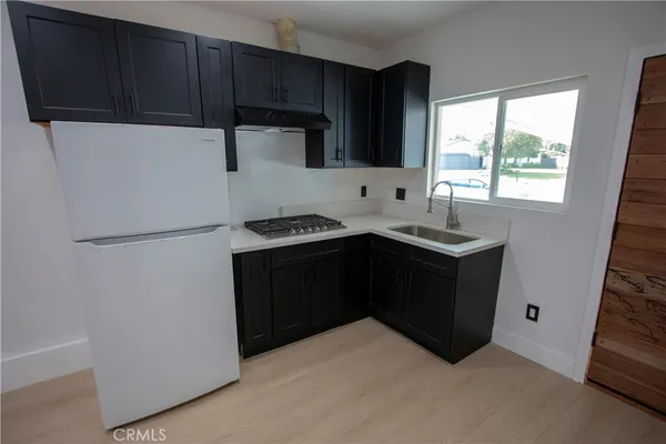 a kitchen with a cabinets and a stove