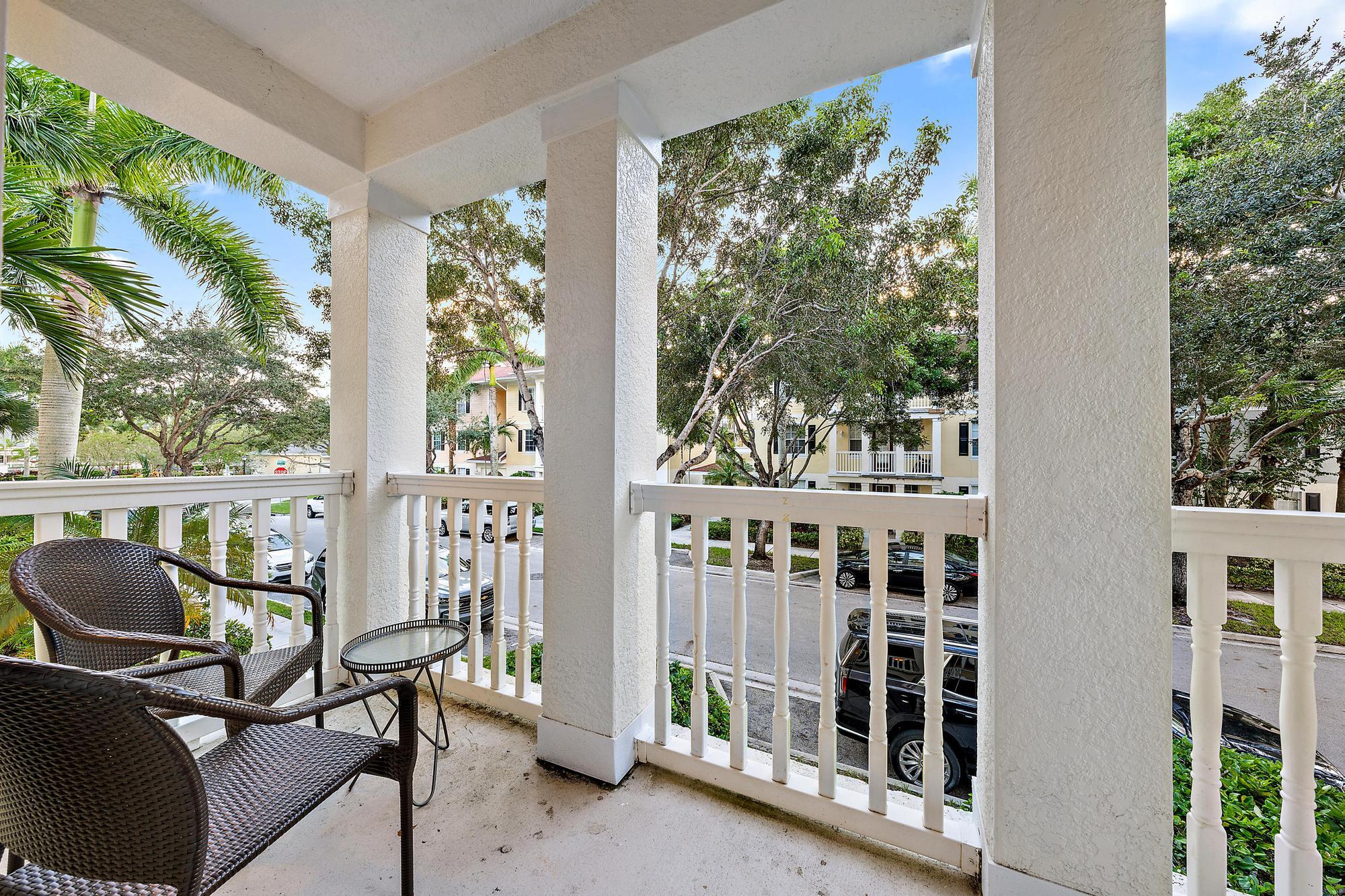 225 Murcia Drive, Unit 201 Jupiter, FL 33458 - Photo 19 of 42 a view of a balcony with chairs