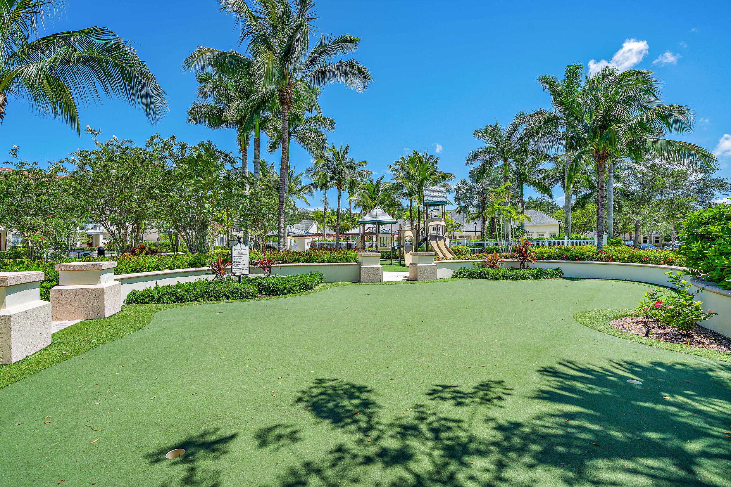 225 Murcia Drive, Unit 201 Jupiter, FL 33458 - Photo 28 of 42 a view of a garden with swimming pool