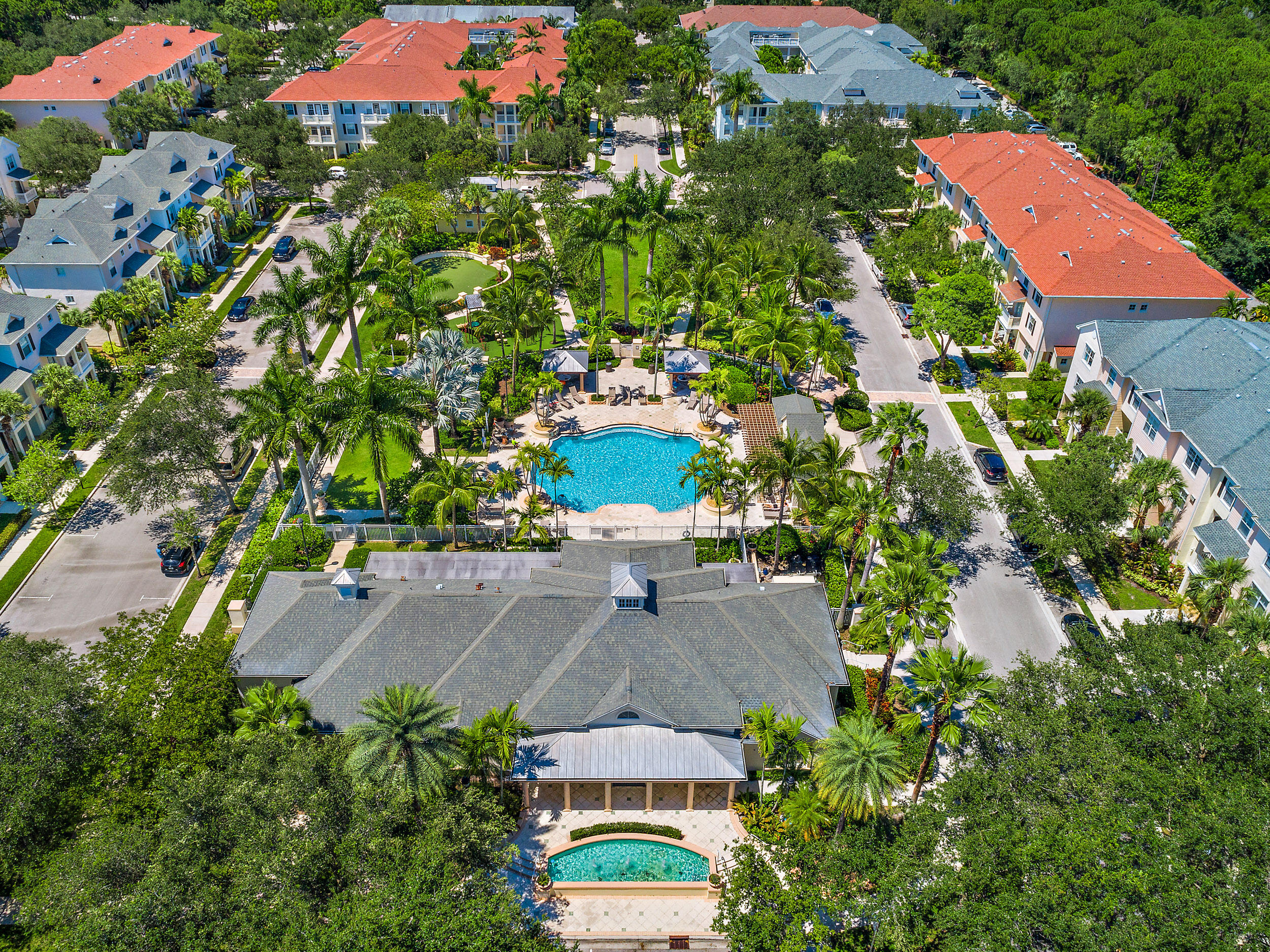 225 Murcia Drive, Unit 201 Jupiter, FL 33458 - Photo 32 of 42 an aerial view of a house with a yard and garden