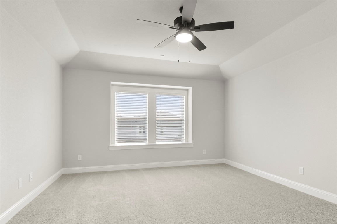 2605 Sam Bass Road, Unit 87 Round Rock, TX 78681 - Photo 17 of 31 an empty room with a window and a fan