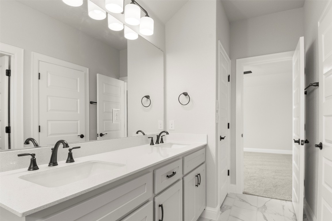 2605 Sam Bass Road, Unit 87 Round Rock, TX 78681 - Photo 21 of 31 a bathroom with a sink vanity granite and a mirror