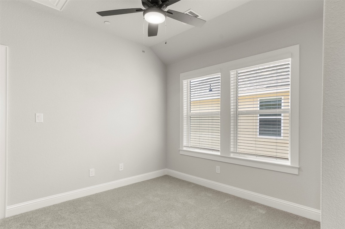 2605 Sam Bass Road, Unit 87 Round Rock, TX 78681 - Photo 24 of 31 an empty room with a window and a fan