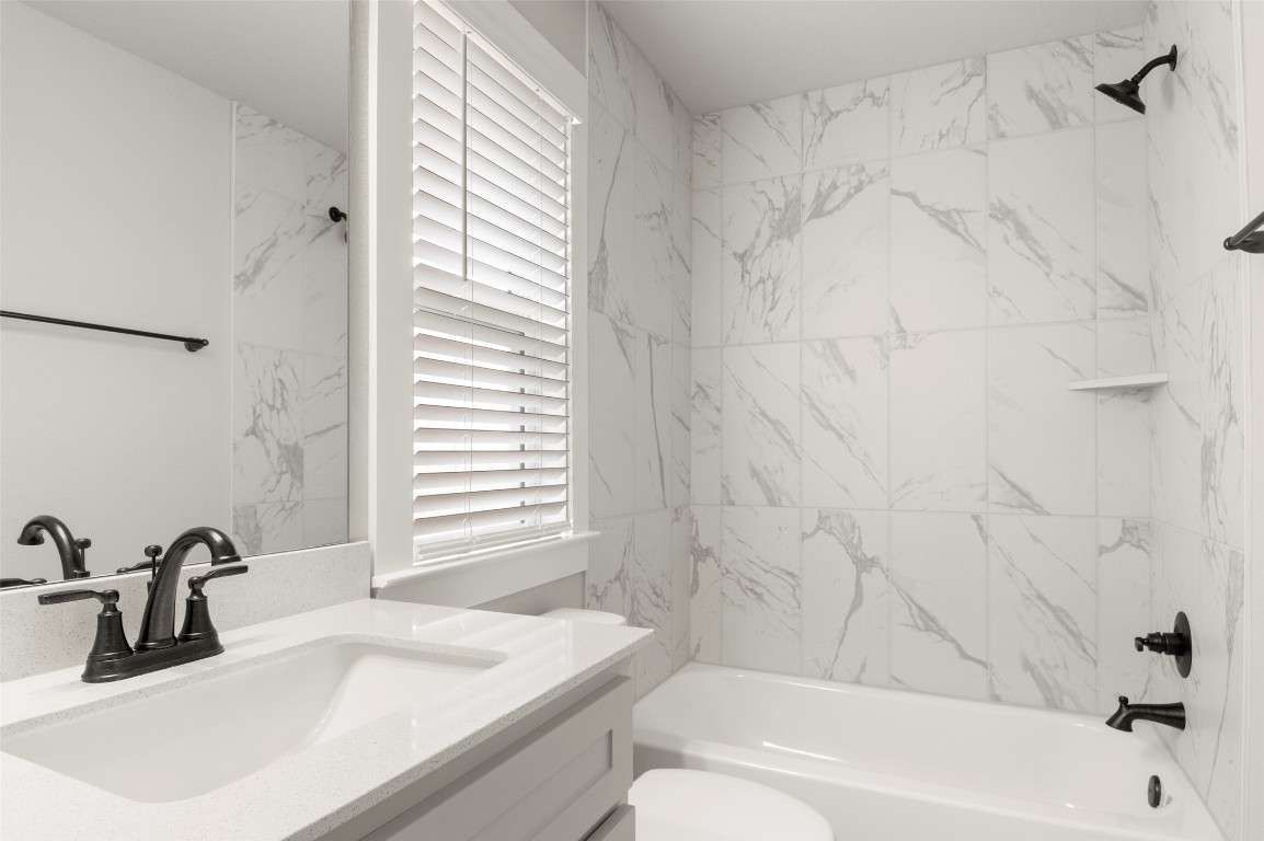 2605 Sam Bass Road, Unit 87 Round Rock, TX 78681 - Photo 25 of 31 a bathroom with a sink and a bathtub
