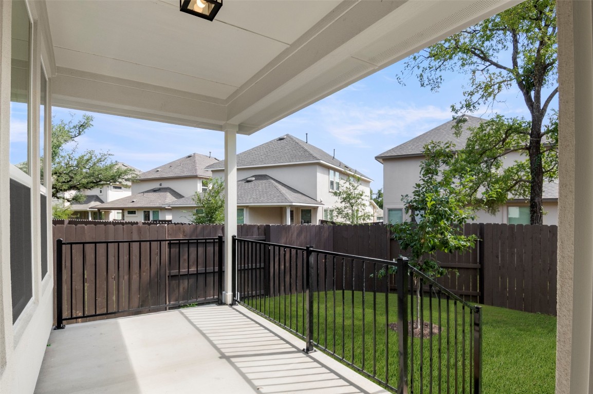 2605 Sam Bass Road, Unit 87 Round Rock, TX 78681 - Photo 29 of 31 a view of a house with backyard and porch