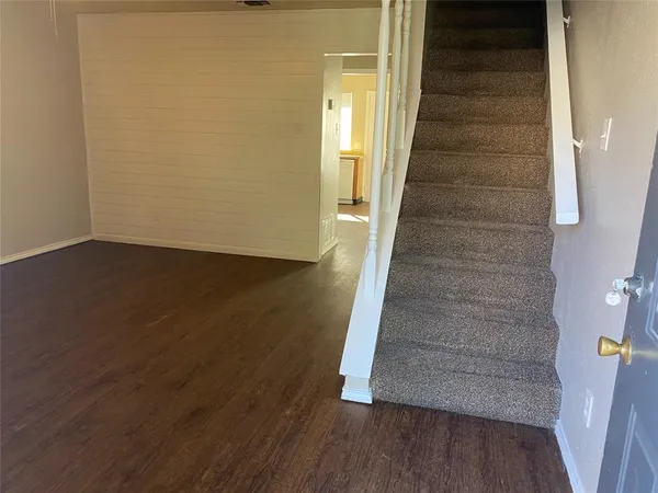 a view of entryway with wooden floor