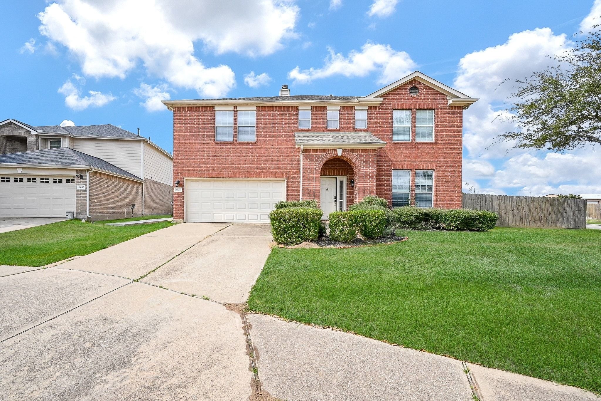 6638 Autumn Sunset Lane Spring, TX 77379 - Photo 3 of 32 Stunning curb appeal with a welcoming brick facade.