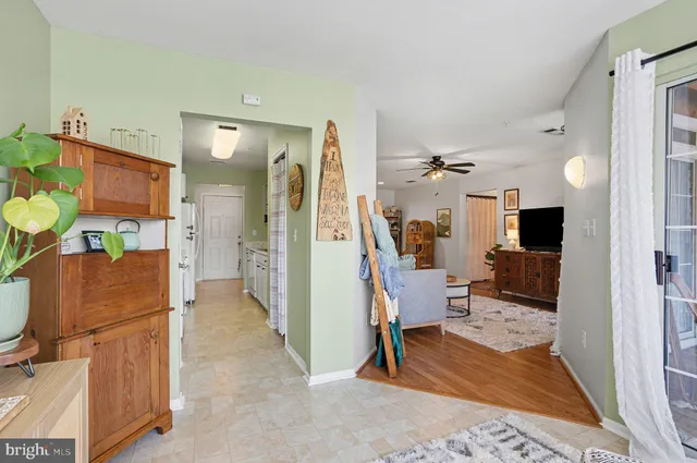 a living room with furniture a rug and a window