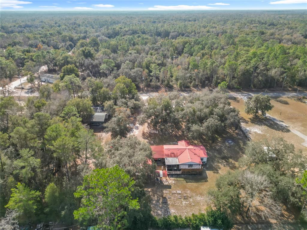 9575 Southwest 155th Street Dunnellon, FL 34432 - Photo 2 of 50 an aerial view of a house with a yard