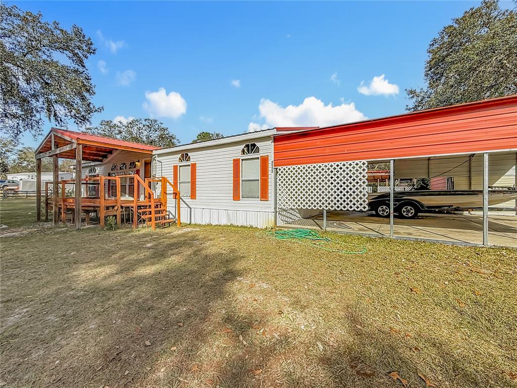 9575 Southwest 155th Street Dunnellon, FL 34432 - Photo 47 of 50 a view of a house with a backyard