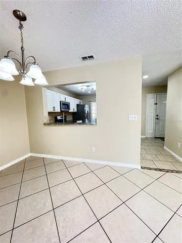 a view of a kitchen with a sink and cabinets