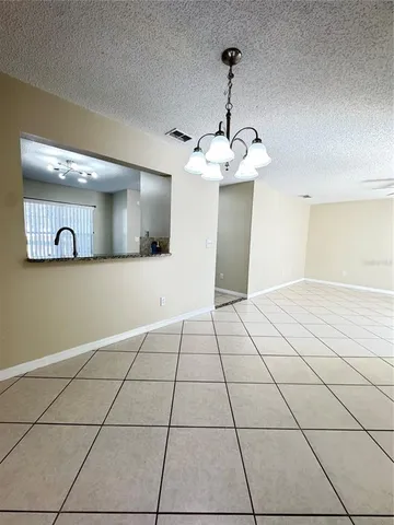 a view of an empty room and a window