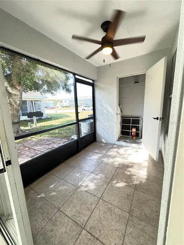 a view of open kitchen with wooden floor and a window