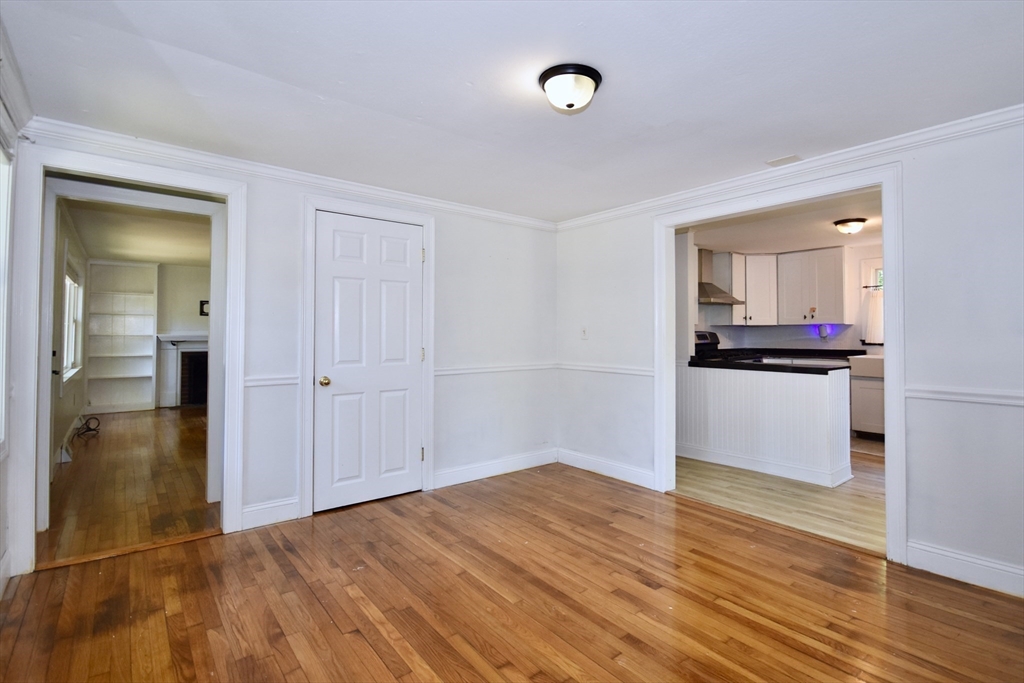 296 Lincoln Road Barnstable, MA 02601 - Photo 12 of 20 a view of a kitchen with wooden floor and a refrigerator