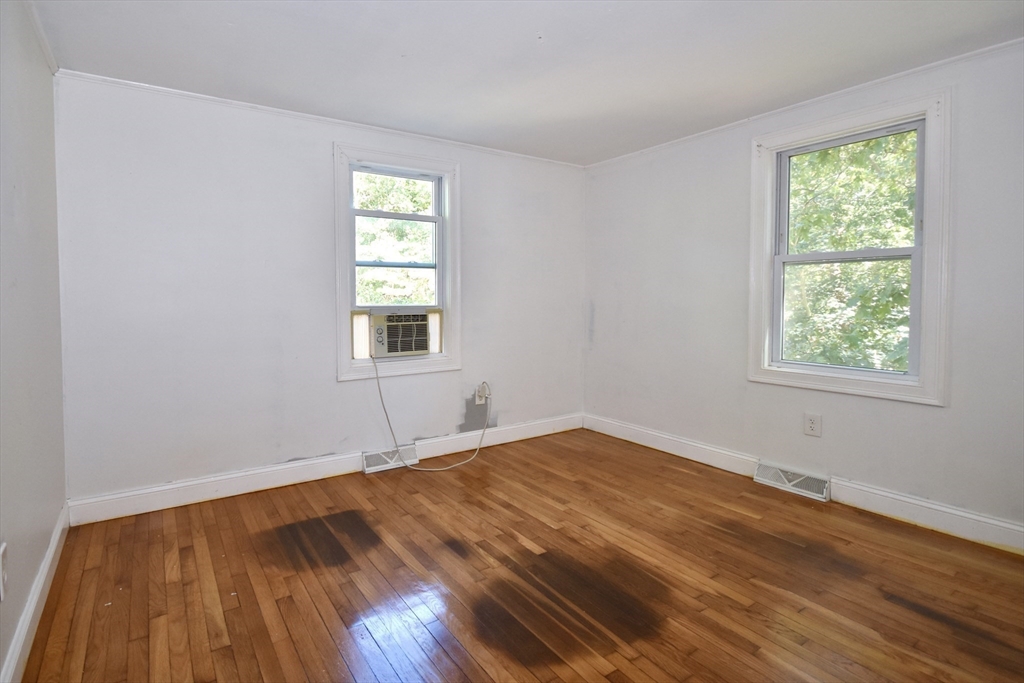 296 Lincoln Road Barnstable, MA 02601 - Photo 13 of 20 an empty room with wooden floor and windows