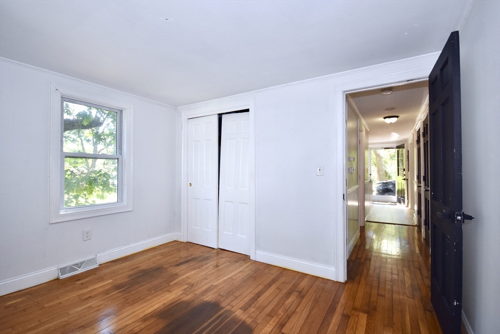 296 Lincoln Road Barnstable, MA 02601 - Photo 14 of 20 an empty room with wooden floor and windows