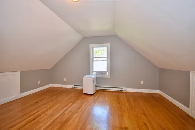 a view of wooden floor and windows in a room