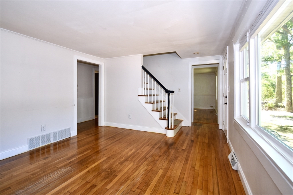 296 Lincoln Road Barnstable, MA 02601 - Photo 9 of 20 a view of a hallway with wooden floor and staircase