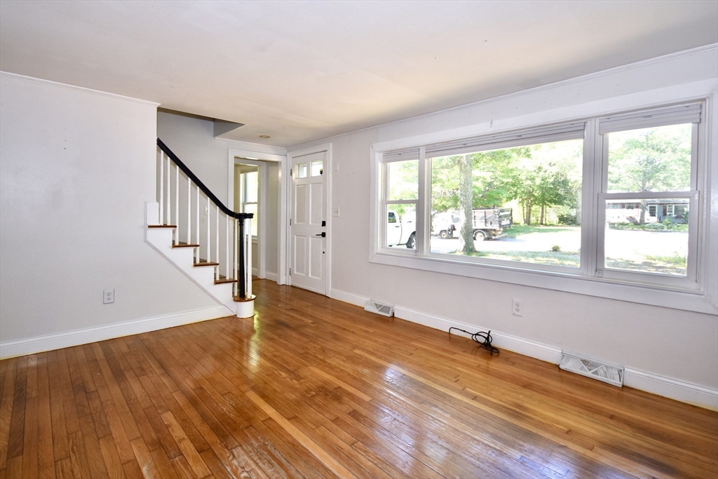 296 Lincoln Road Barnstable, MA 02601 - Photo 10 of 20 a view of an empty room with wooden floor and a window
